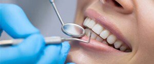 Close-up healthy smile with dental tools
