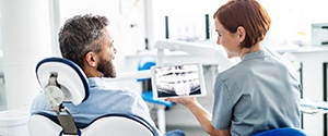 Agawam implant dentist and patient discuss dental implants 