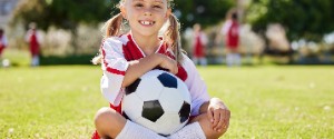 Child smiles on soccer field