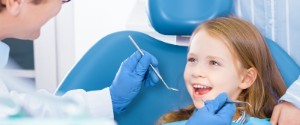 Child smiles at dentist