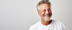 a man with dentures grinning and happy