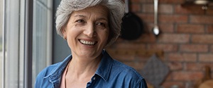 smiling older woman in a kitchen