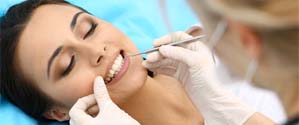 Woman at dentist for a cleaning and checkup