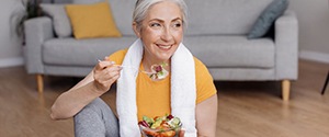 a woman enjoying a bowl of healthy food