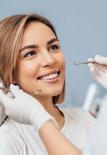 a patient receiving a dental checkup near Southwick