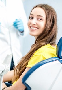 a patient smiling after undergoing cosmetic dentistry near Feeding Hills