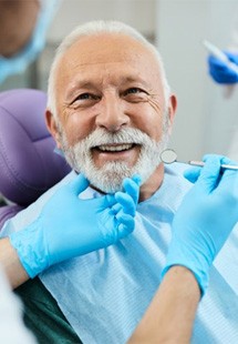 a patient receiving tooth replacements near Southwick