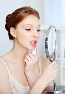 a woman checking her gums near Feeding Hills