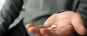 a person taking a pill