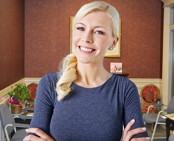 Smiling woman wearing blue sweater
