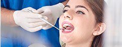 Woman receiving dental exam