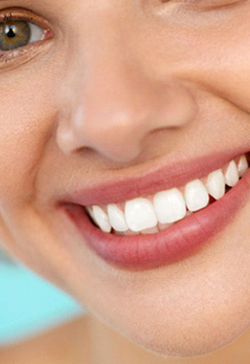 Eye-to-neck view of woman with hazel eyes smiling