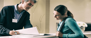 Woman reviewing insurance forms at dental office