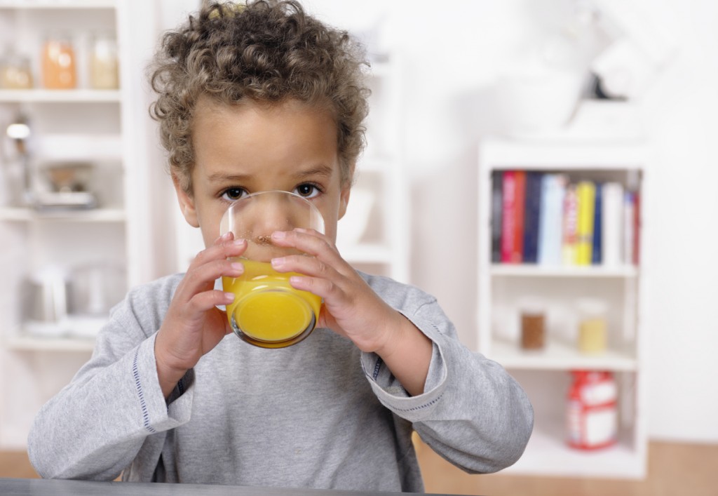 Closeup Of Biracial Toddler Drinking Orange Juice Lifetime Dental Blog