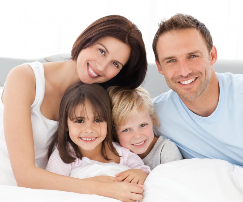 family of four happy about visiting the dentist