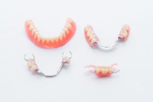 Examples of partials and dentures to treat tooth loss.