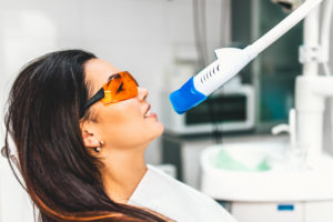 woman undergoing teeth whitening process