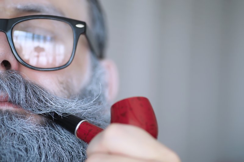 man smoking a pipe