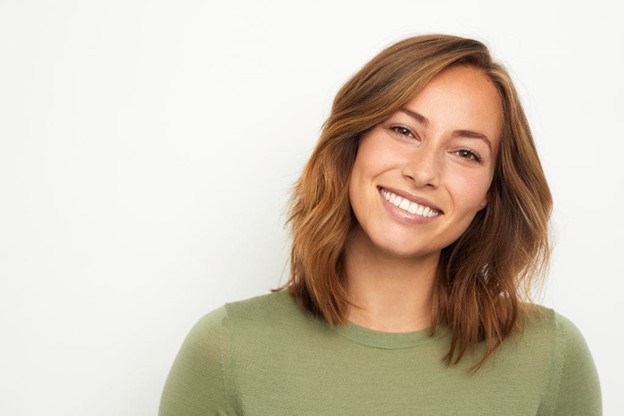 person smiling after having small teeth fixed